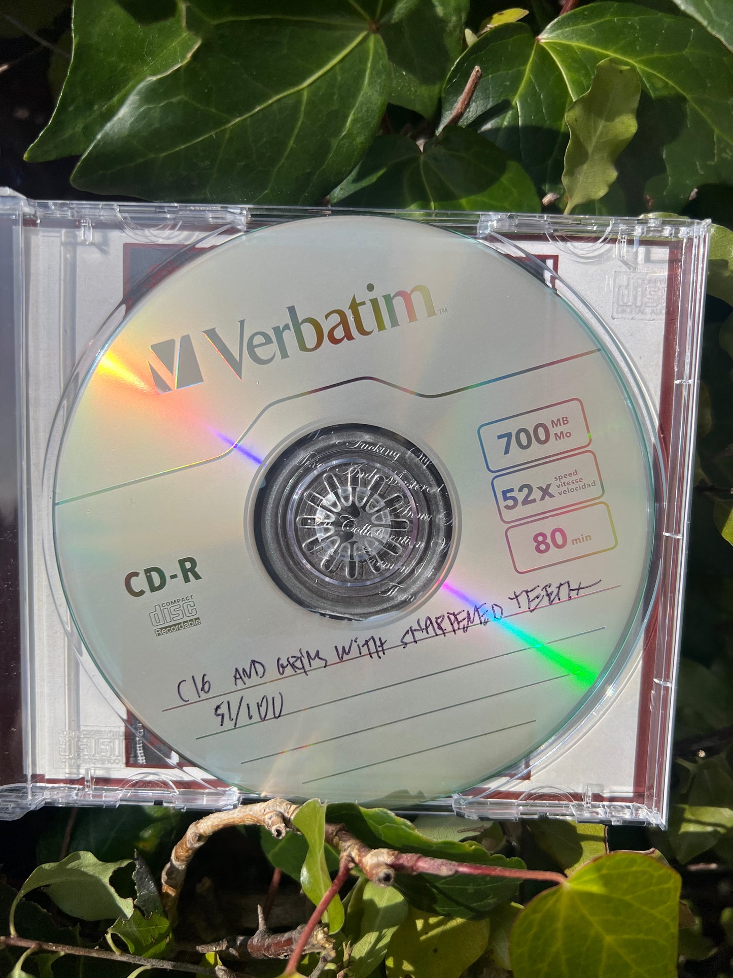 Carmen Sixteen “…And Grins With Sharpened Teeth…” CD